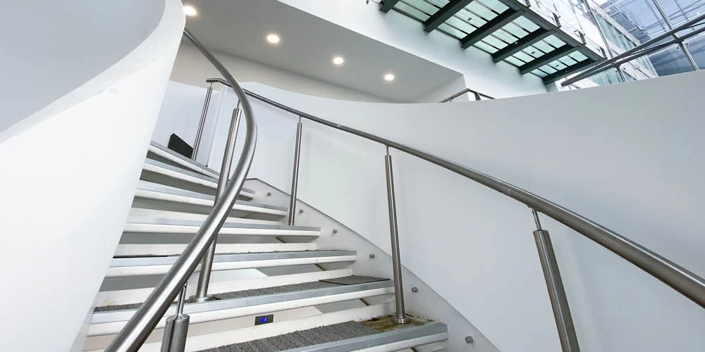 curved helical staircase spiral uk stairs bespoke staircases white balustrade