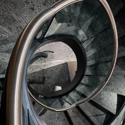 Victorinox Spiral UK Helical Staircase Bespoke Manufacturer cantilever floating stairs dog legged straight London Fit Out