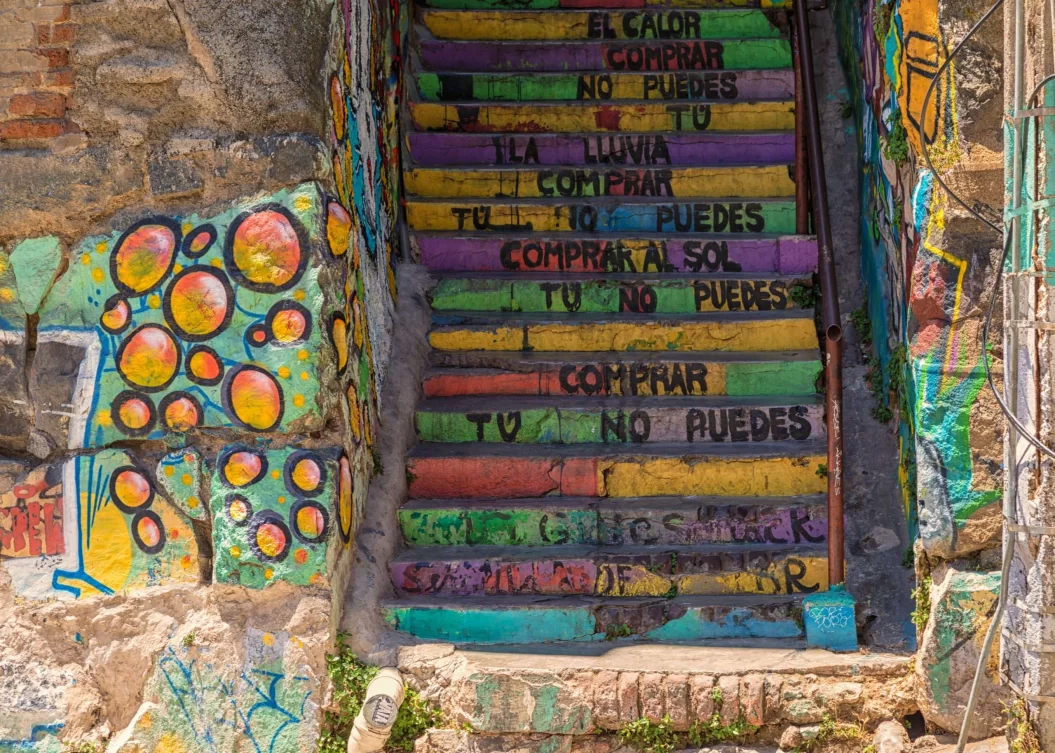 Colourful painted steps with Spanish poetry painted onto the front