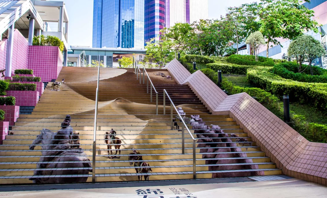 Staircase with images of people on horseback painted onto the front